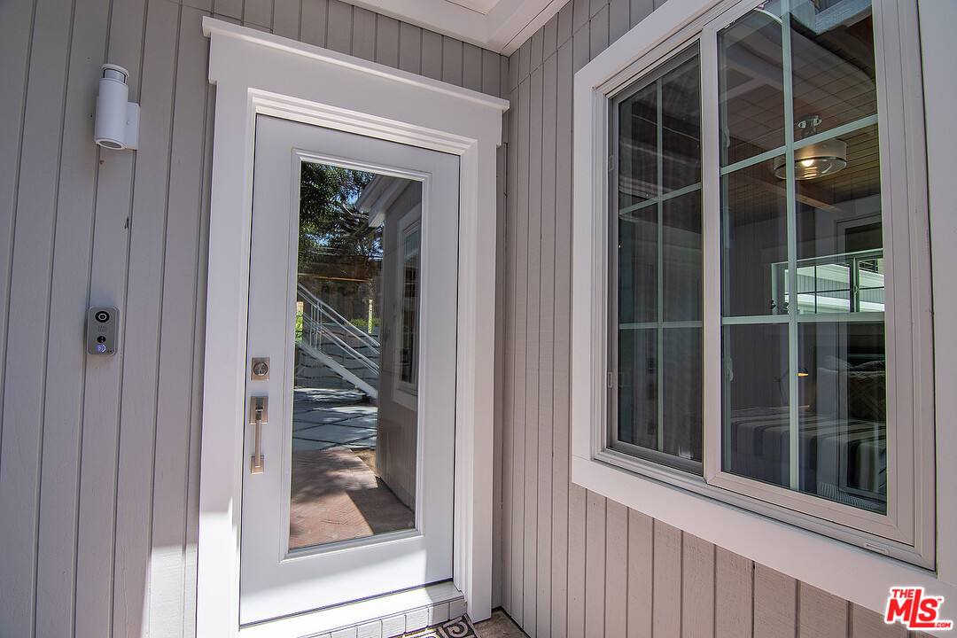 3908-a Las Flores Canyon Road Malibu, CA 90265 - Photo 4 of 60 a view of a glass door with a door