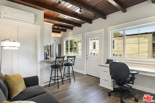 a utility room with cabinets washer and dryer