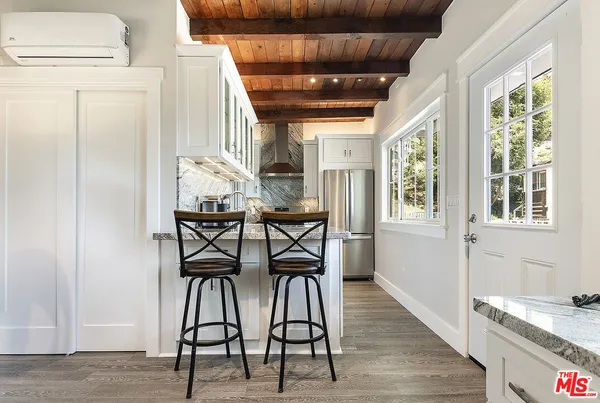 a kitchen with a sink and a refrigerator