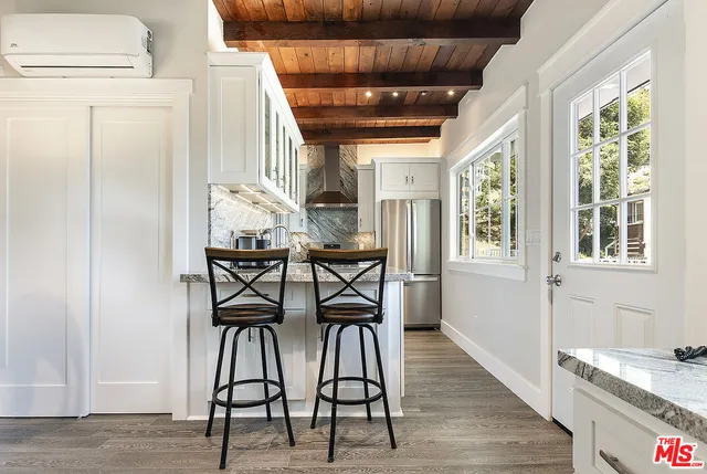 a kitchen with a sink and a refrigerator