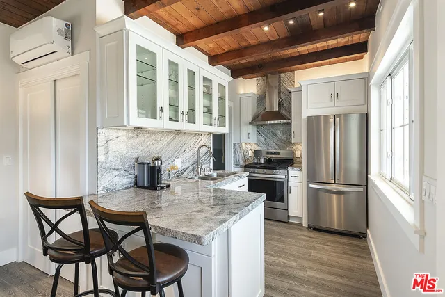 a bathroom with a toilet sink and a mirror