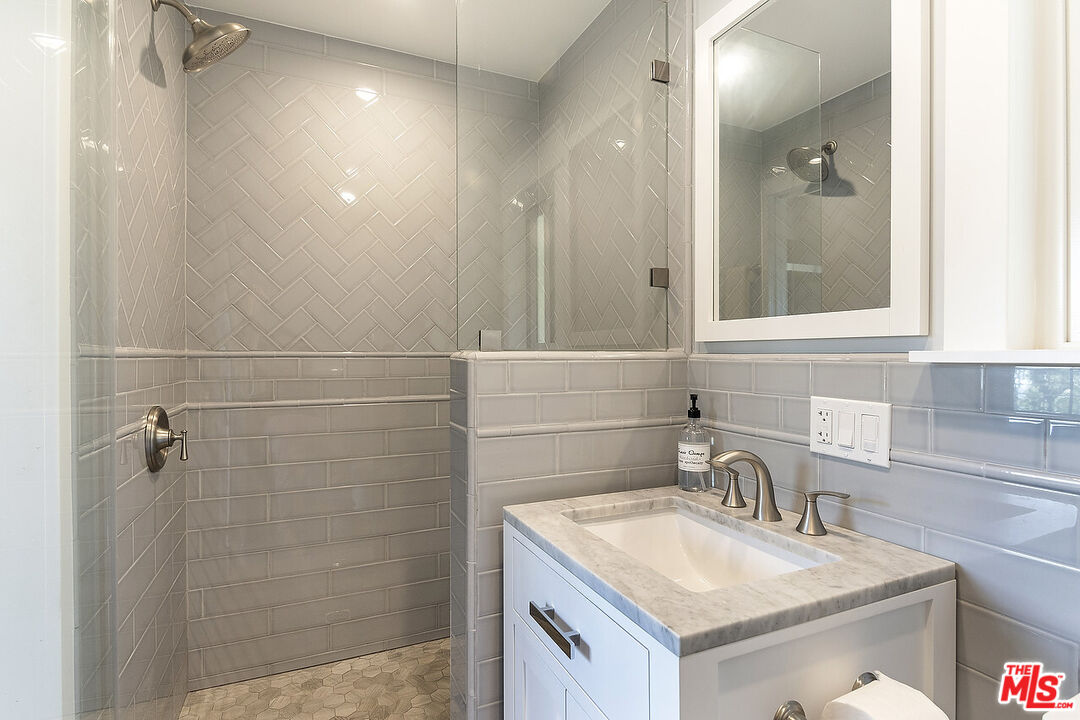 3908-a Las Flores Canyon Road Malibu, CA 90265 - Photo 49 of 60 a bathroom with a sink vanity and shower
