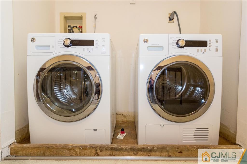 405 Maplecrest Road, Unit 405 Edison, NJ 08820 - Photo 16 of 33 a view of a washer and dryer in a utility room