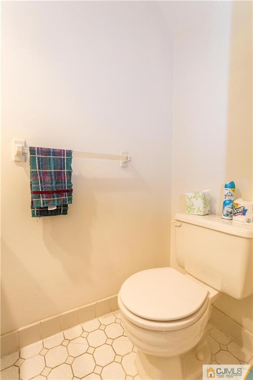 405 Maplecrest Road, Unit 405 Edison, NJ 08820 - Photo 30 of 33 a bathroom with a toilet and a shower