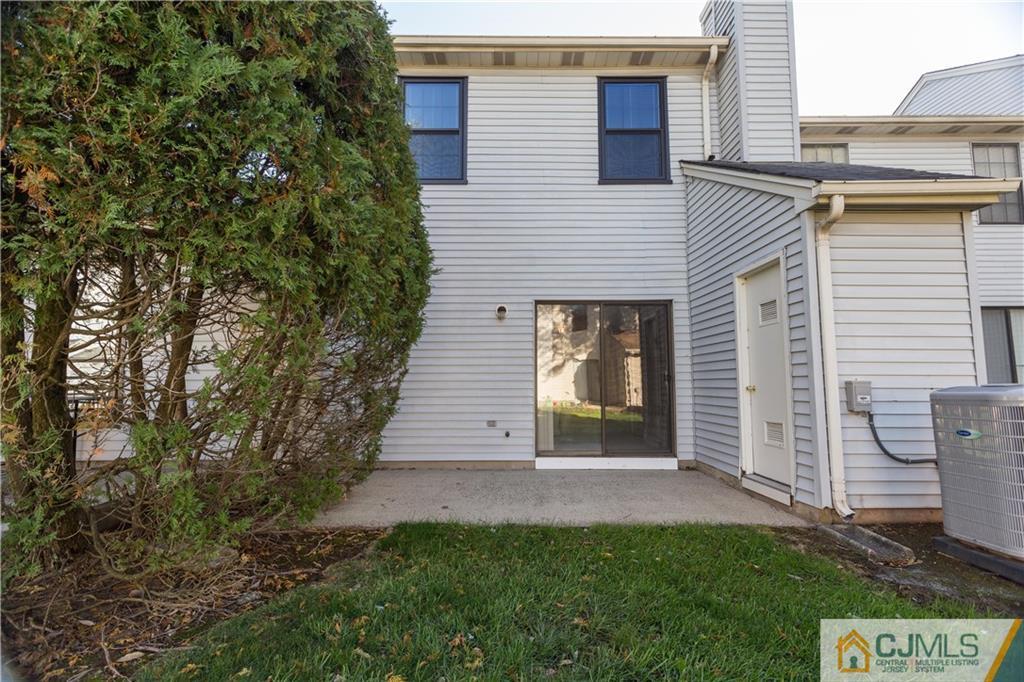 405 Maplecrest Road, Unit 405 Edison, NJ 08820 - Photo 32 of 33 a view of a house with a yard