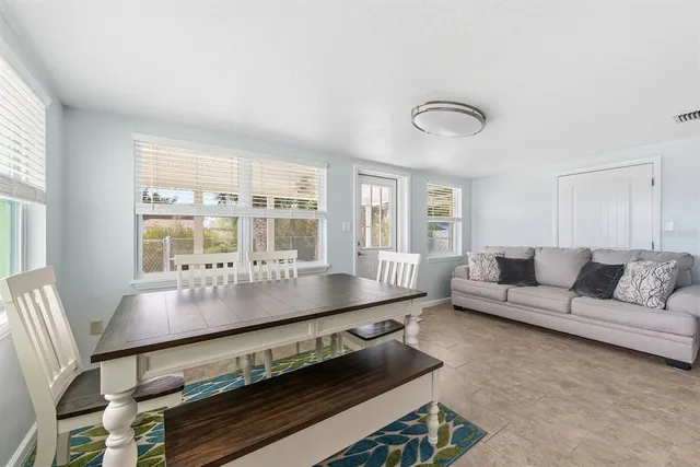 a living room with furniture and windows