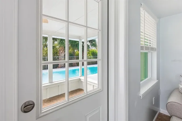 a view of a door and a window