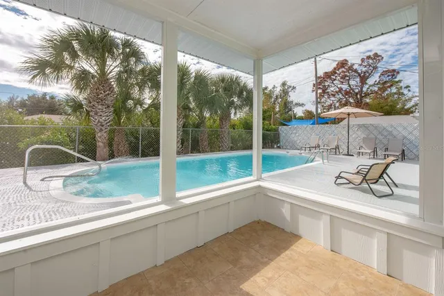 a bathroom with a sink and a large window