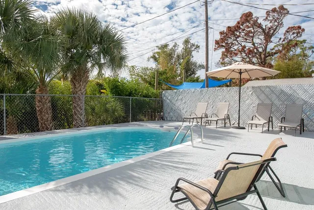a view of a backyard with a patio