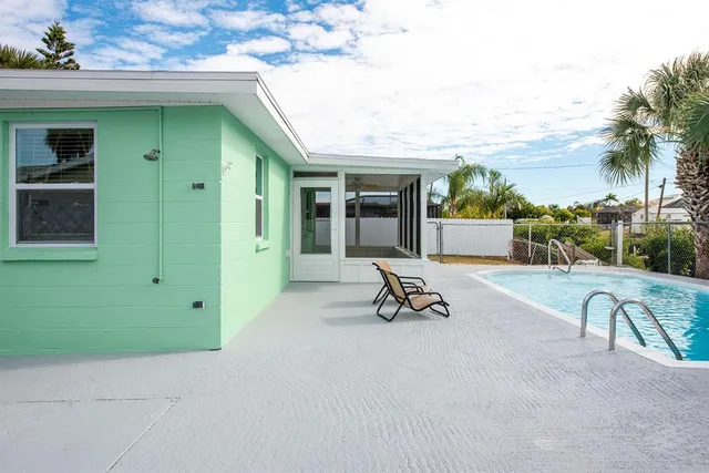 a view of a lounge chairs in front of a building