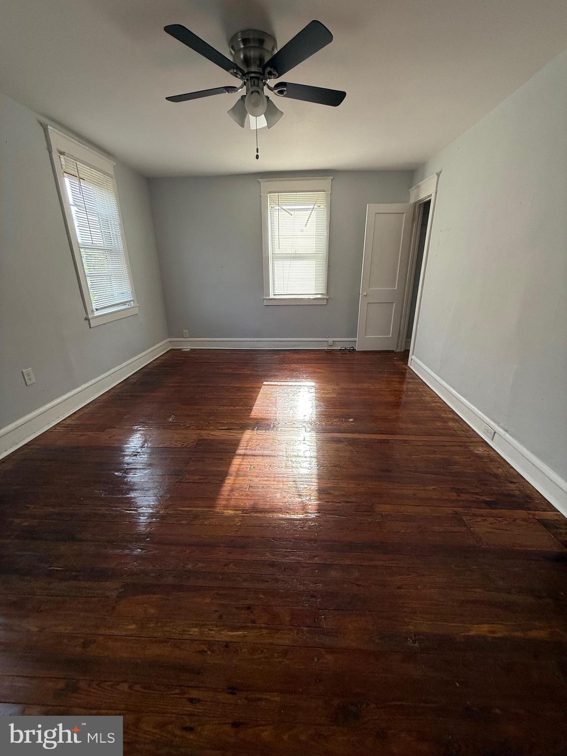 1300 South Merrimac Road Camden, NJ 08104 - Photo 14 of 25 a view of empty room with wooden floor and fan