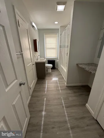 a view of a hallway with windows