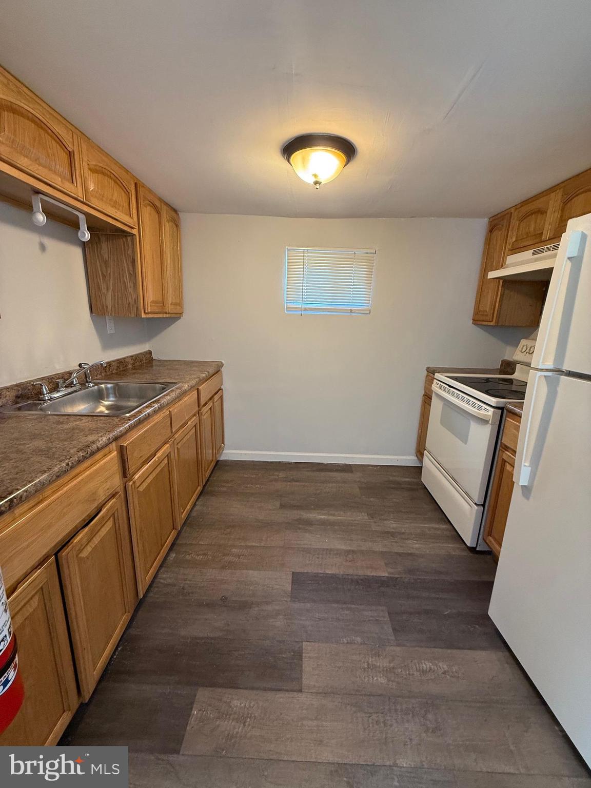 1300 South Merrimac Road Camden, NJ 08104 - Photo 20 of 25 a kitchen with a stove top oven and cabinets
