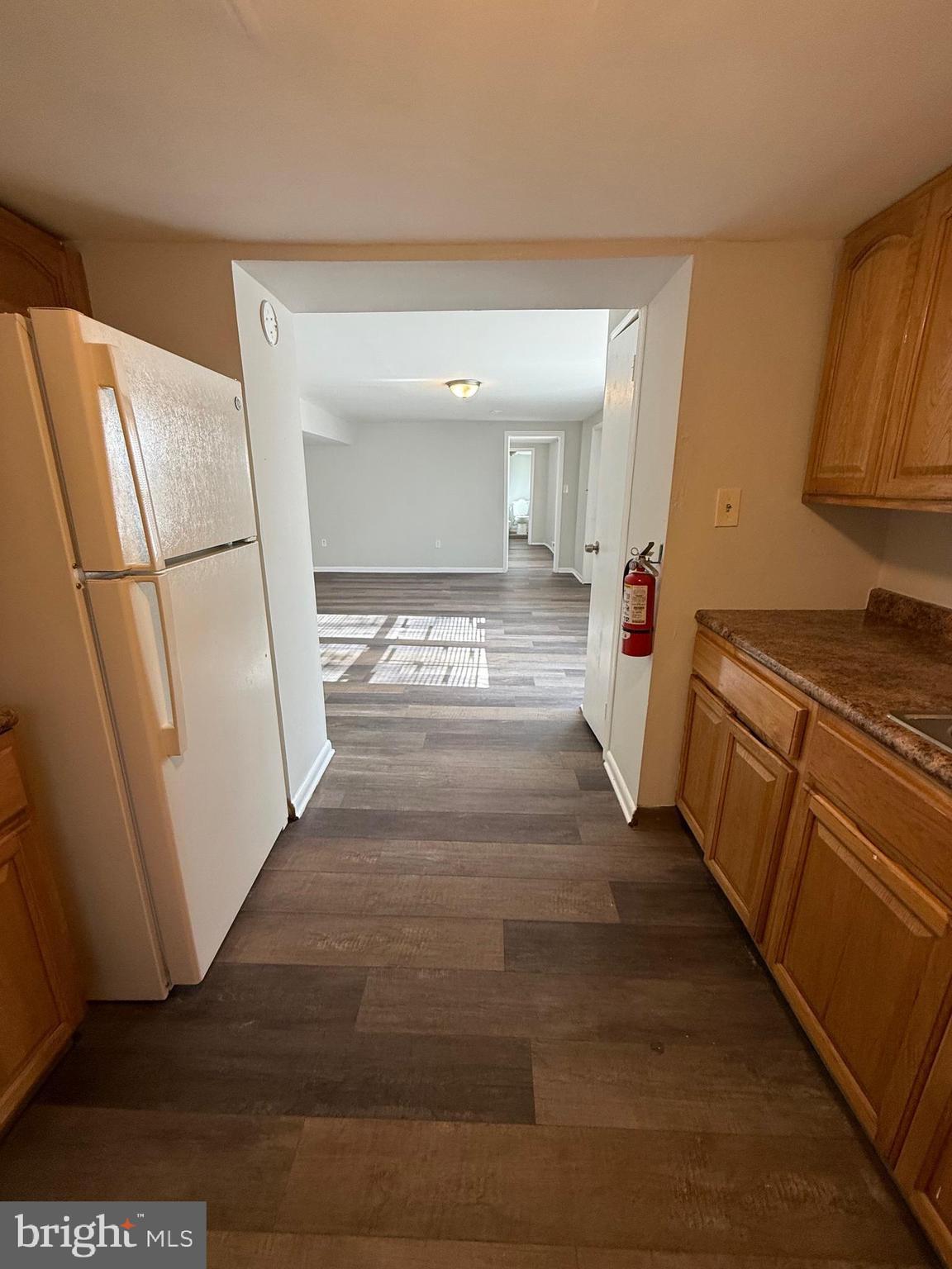 1300 South Merrimac Road Camden, NJ 08104 - Photo 21 of 25 a view of a hallway with wooden floor and staircase