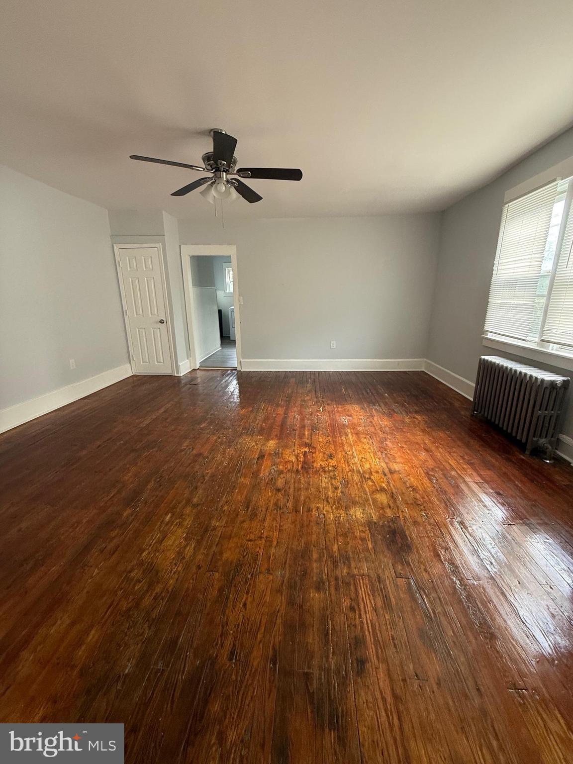1300 South Merrimac Road Camden, NJ 08104 - Photo 6 of 25 wooden floor in an empty room with a window