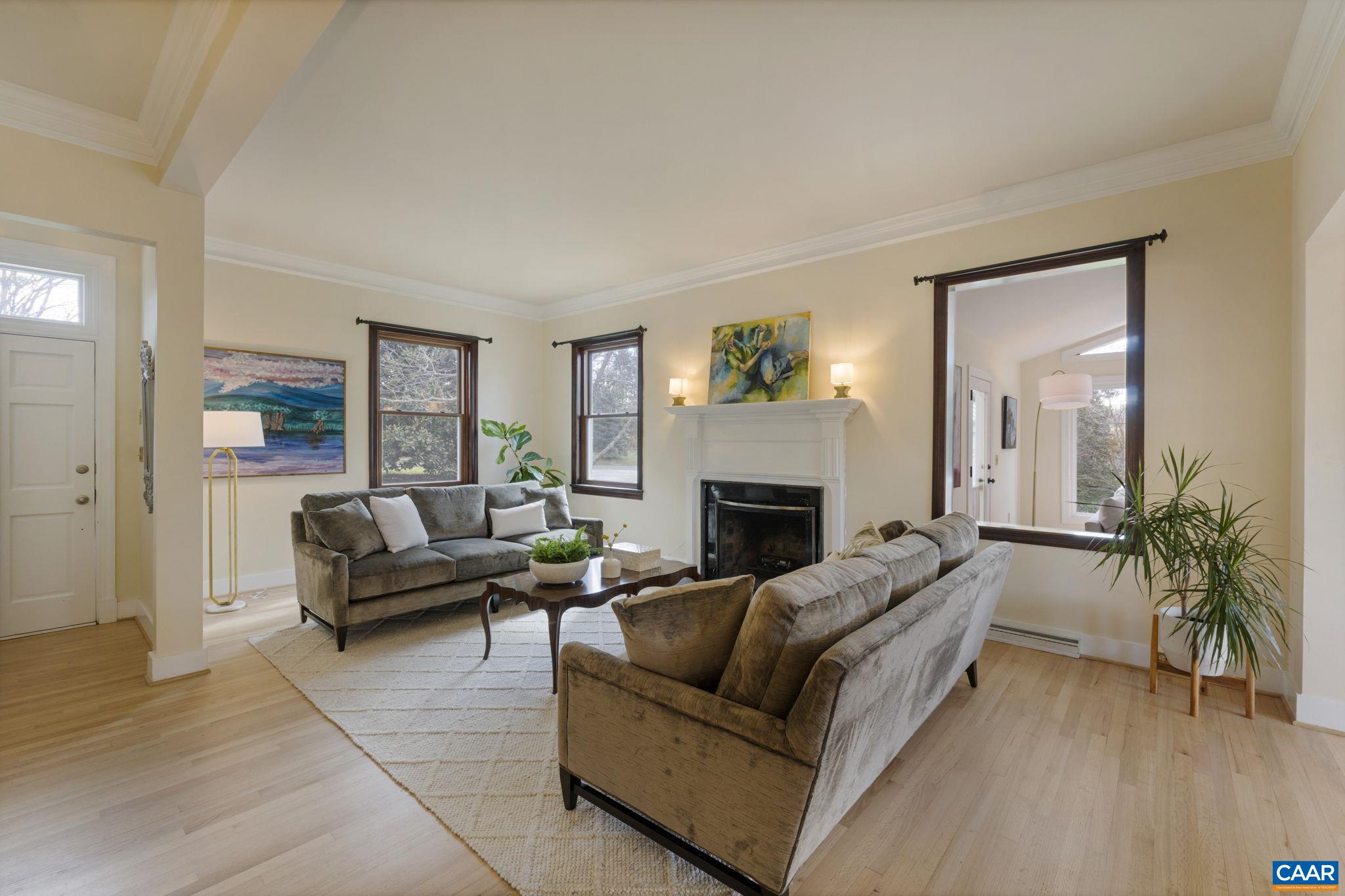 570 Rodes Drive Charlottesville, VA 22903 - Photo 11 of 75 a living room with furniture and a fireplace