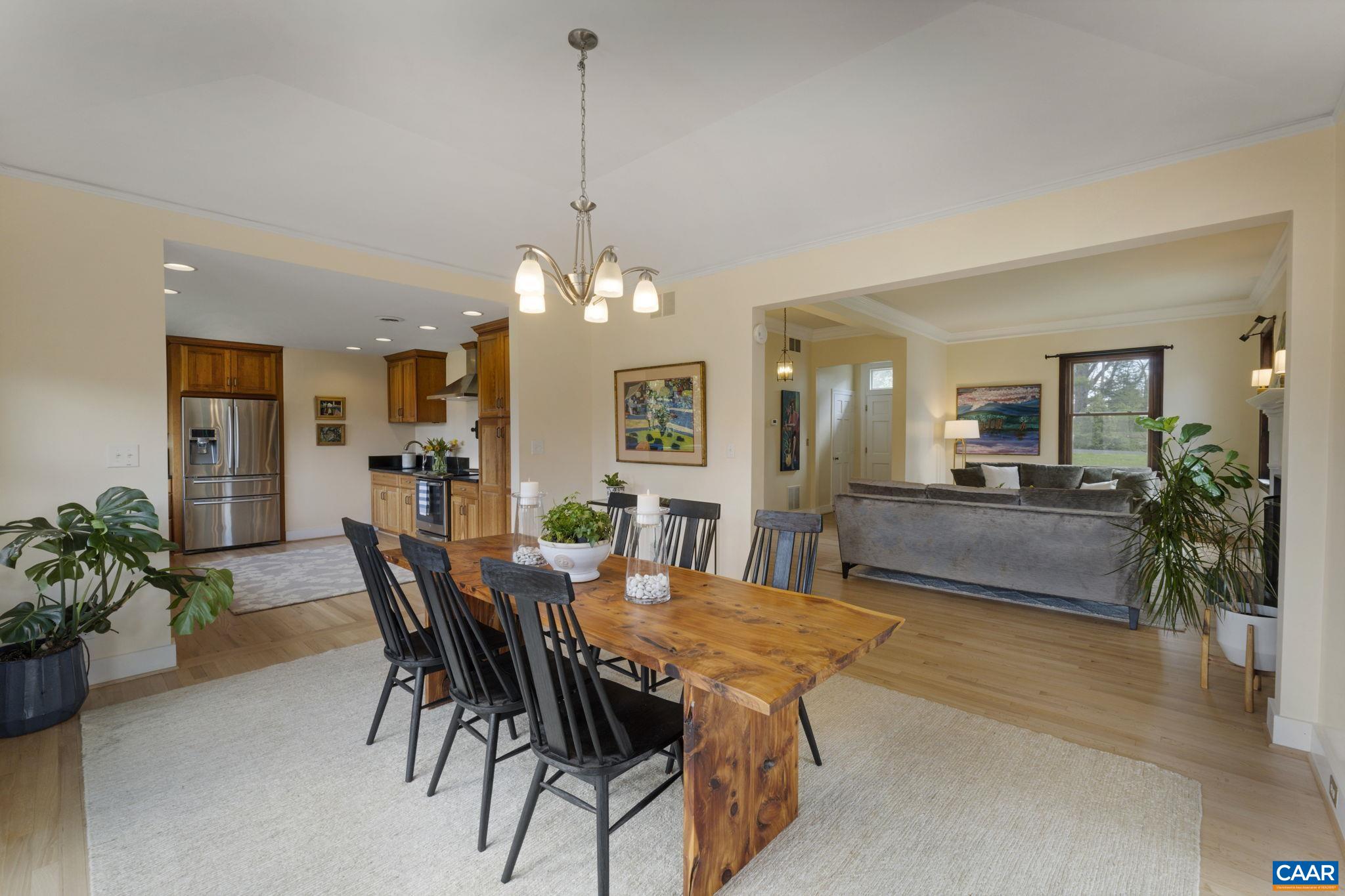 570 Rodes Drive Charlottesville, VA 22903 - Photo 14 of 75 a view of a dining room with furniture and a chandelier