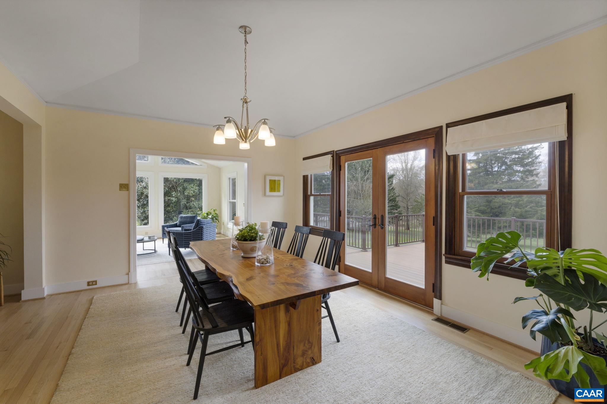 570 Rodes Drive Charlottesville, VA 22903 - Photo 24 of 75 a view of a dining room with furniture window and wooden floor