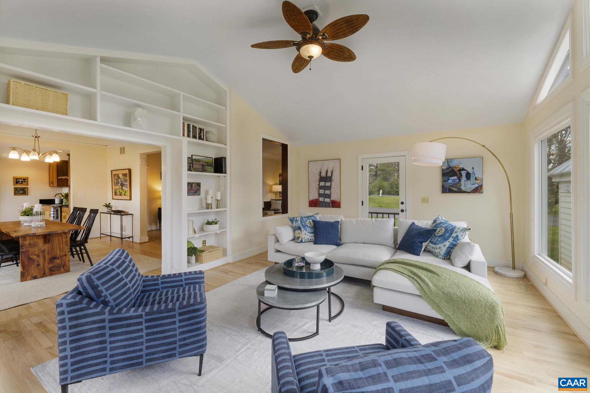 570 Rodes Drive Charlottesville, VA 22903 - Photo 26 of 75 a living room with furniture or couch and a chandelier