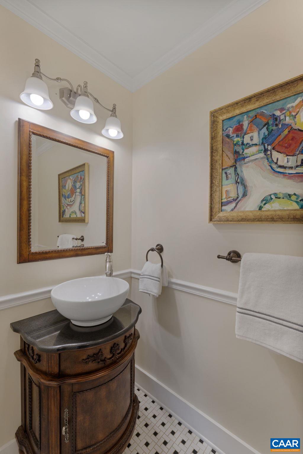 570 Rodes Drive Charlottesville, VA 22903 - Photo 31 of 75 a bathroom with a stove a sink and wall painting