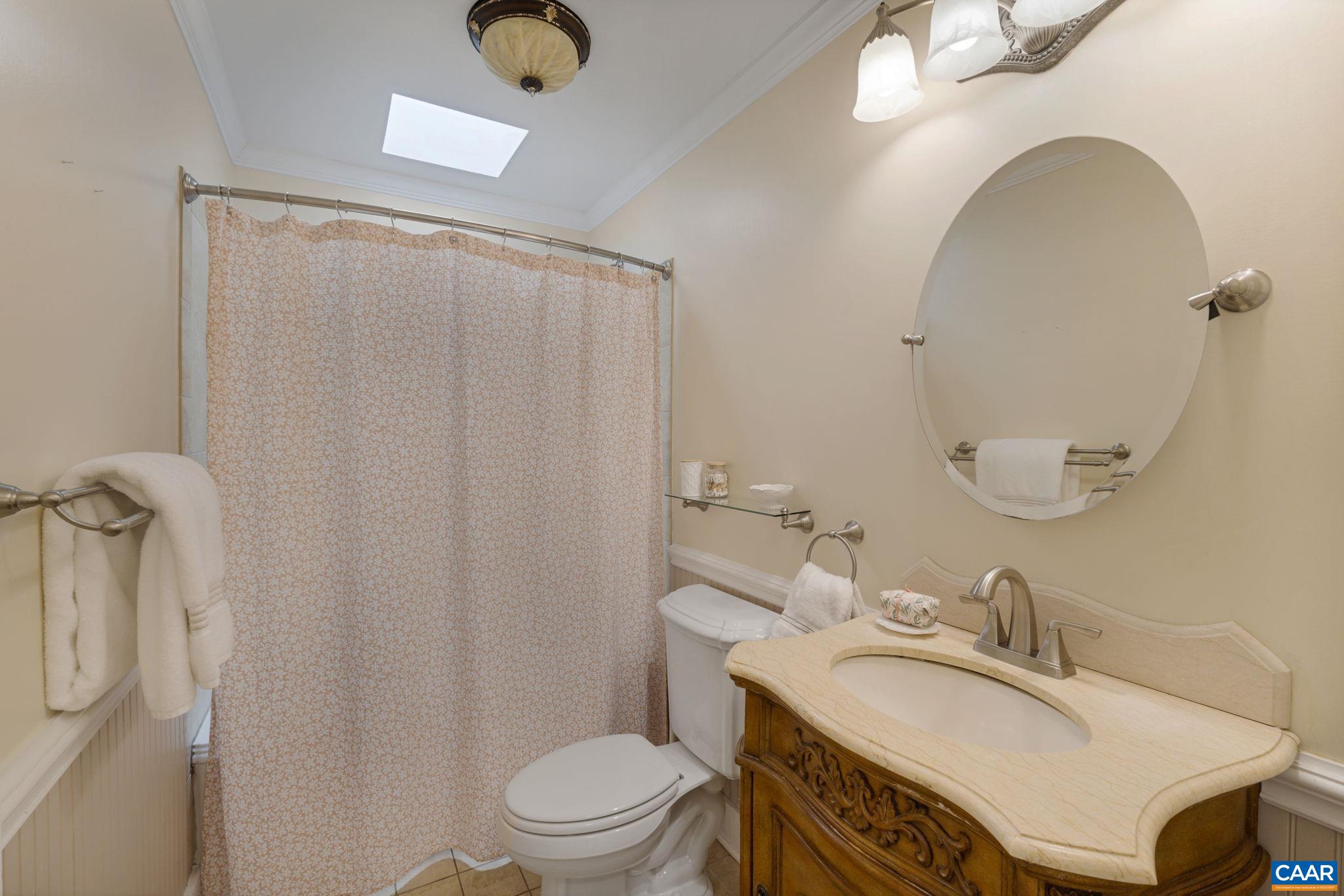 570 Rodes Drive Charlottesville, VA 22903 - Photo 34 of 75 a bathroom with a sink toilet and shower