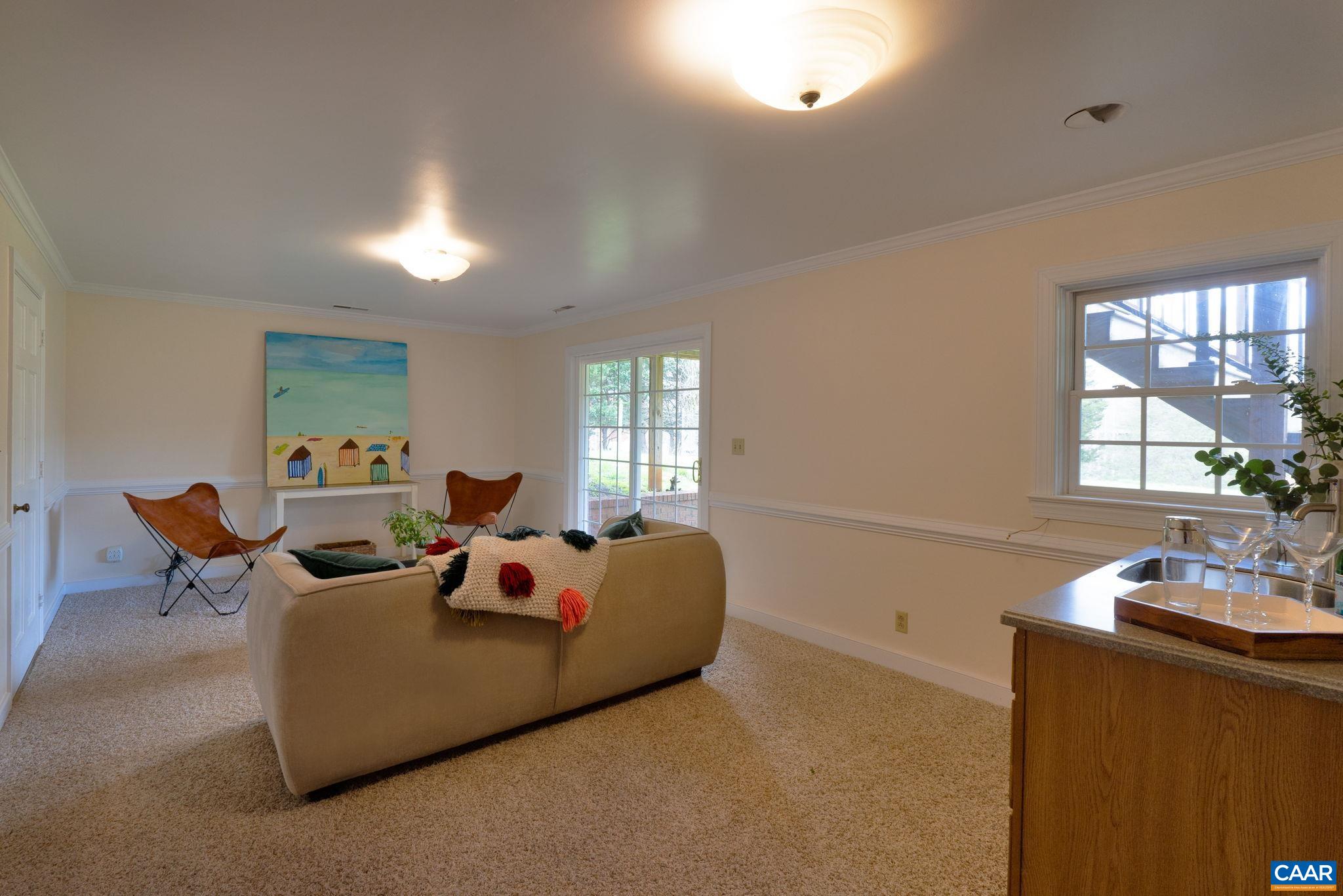 570 Rodes Drive Charlottesville, VA 22903 - Photo 41 of 75 a living room with furniture fireplace and window