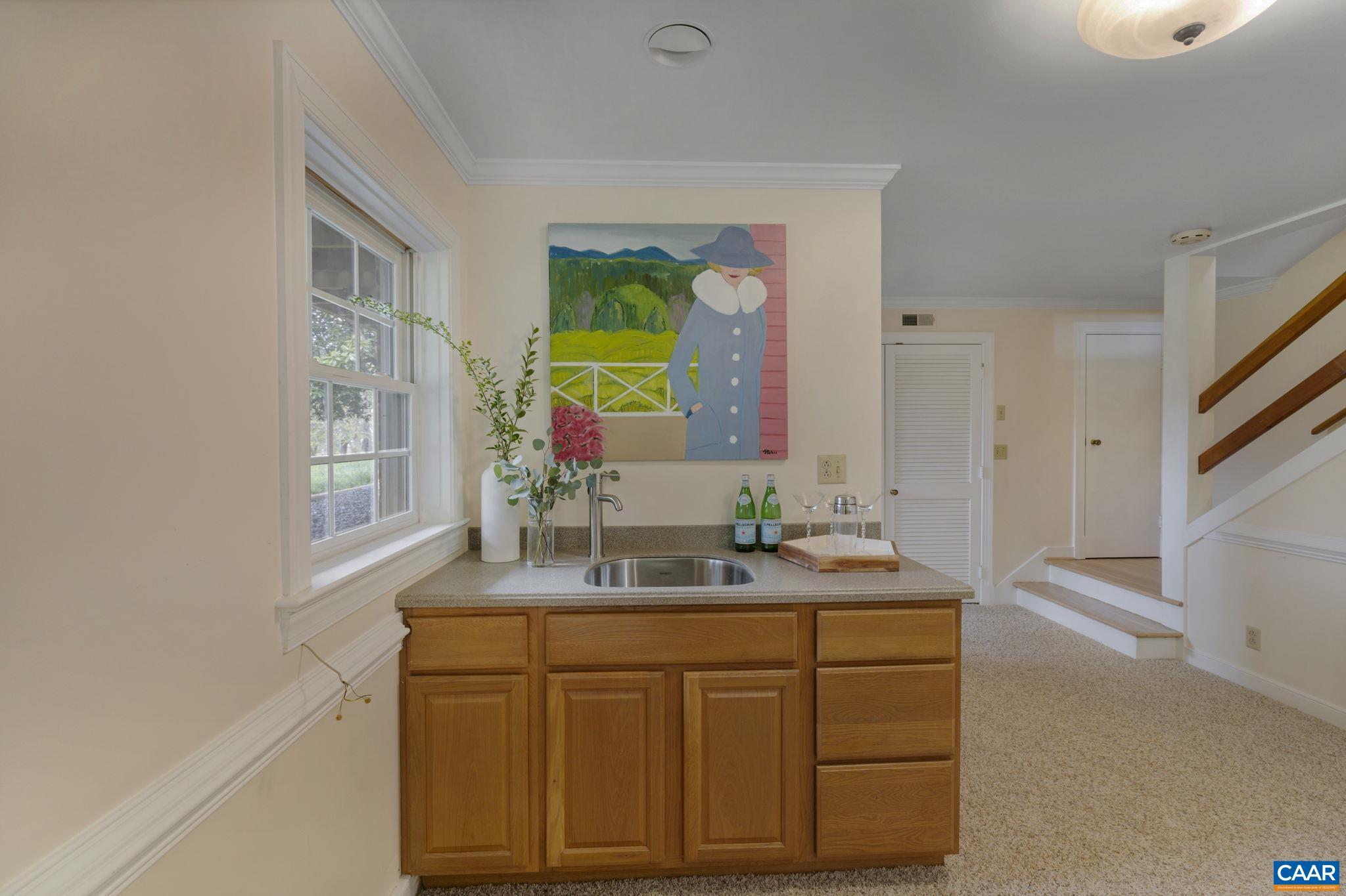 570 Rodes Drive Charlottesville, VA 22903 - Photo 42 of 75 a bathroom with a granite countertop sink and a mirror