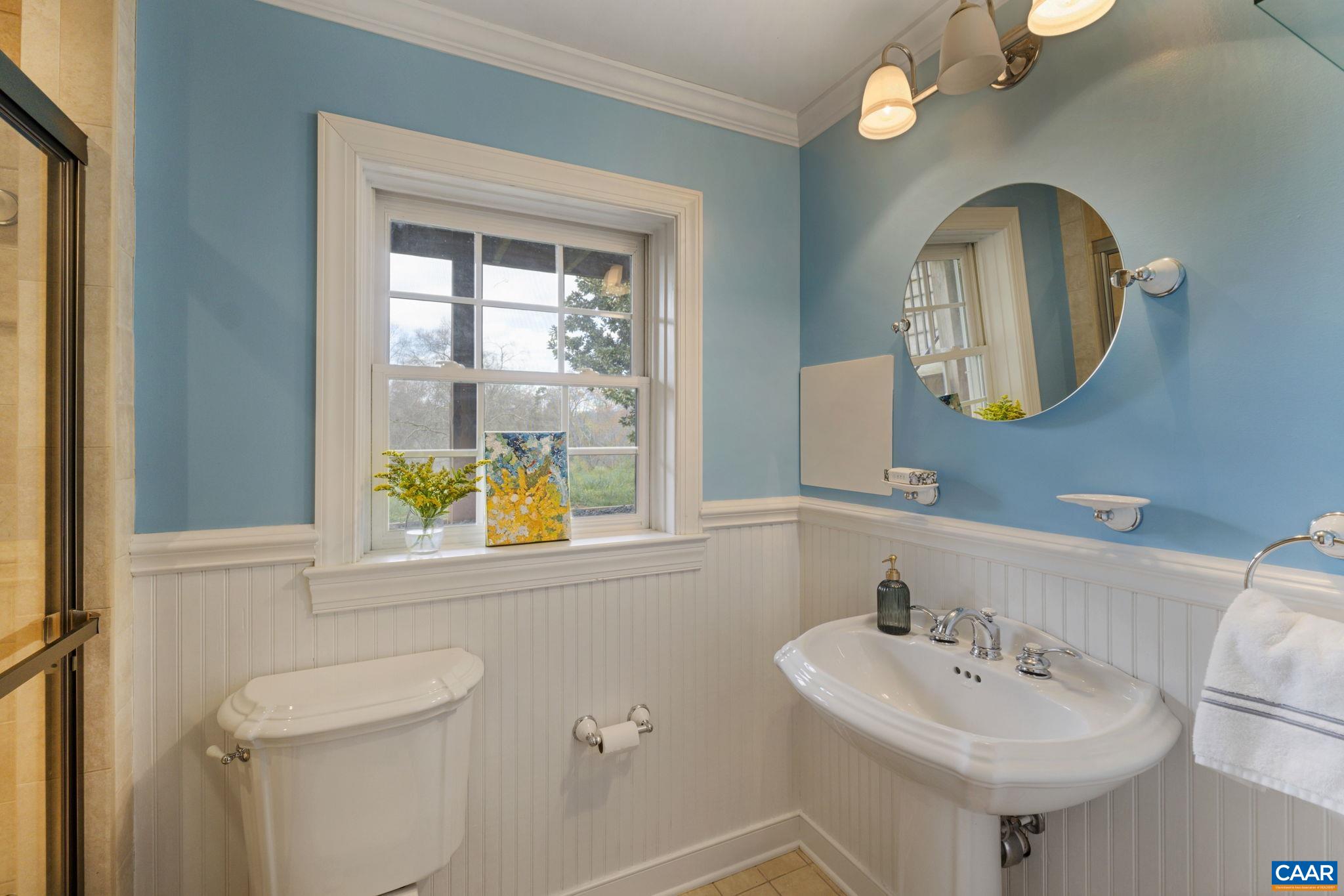 570 Rodes Drive Charlottesville, VA 22903 - Photo 43 of 75 a bathroom with a toilet sink and mirror