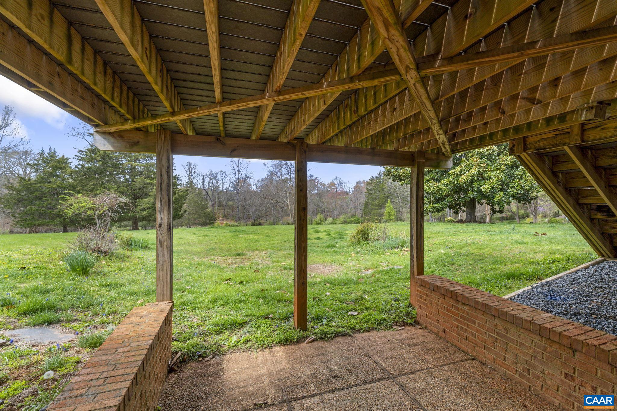 570 Rodes Drive Charlottesville, VA 22903 - Photo 45 of 75 a view of a backyard with wooden floor and roof