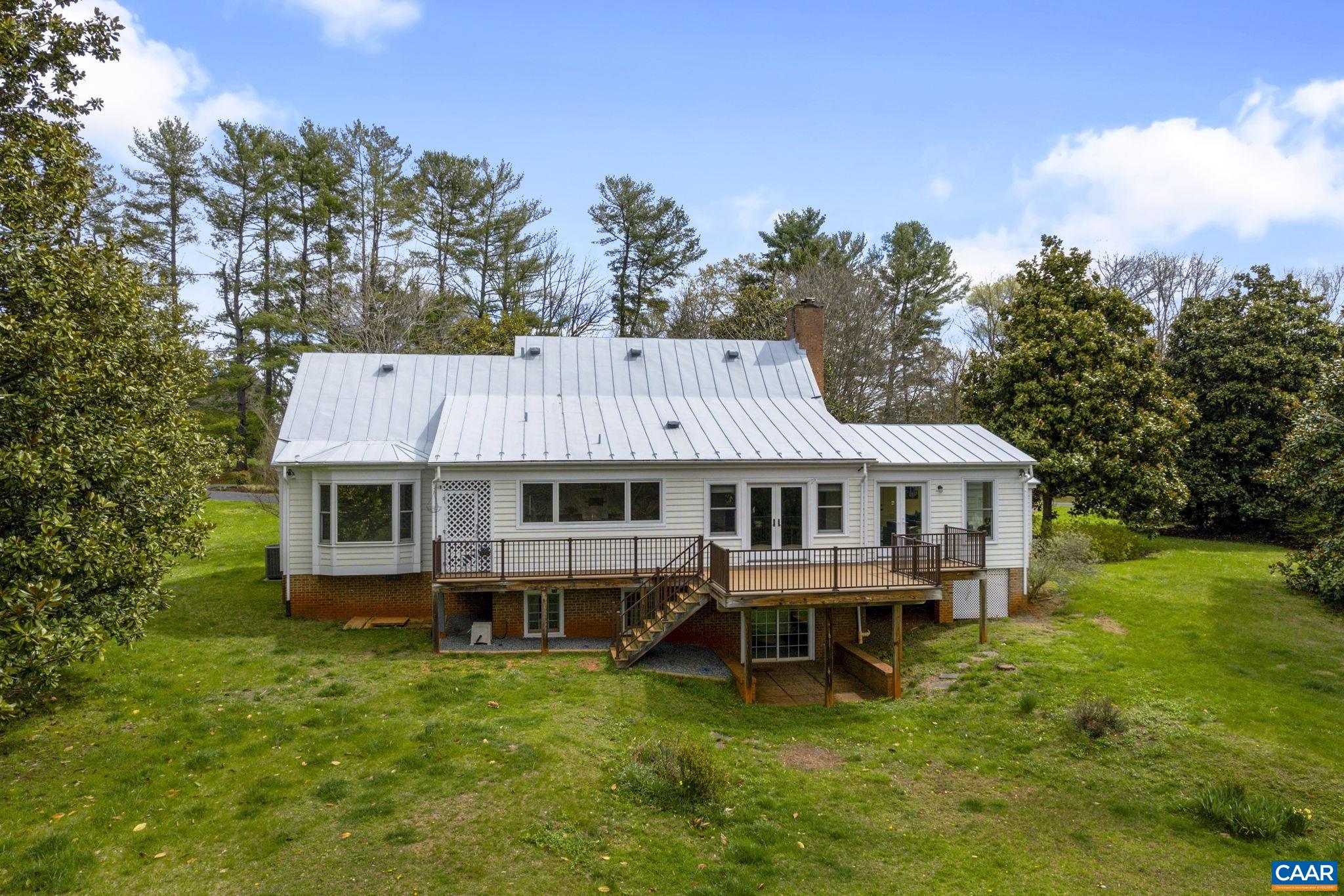 570 Rodes Drive Charlottesville, VA 22903 - Photo 48 of 75 a aerial view of a house with a yard table and chairs