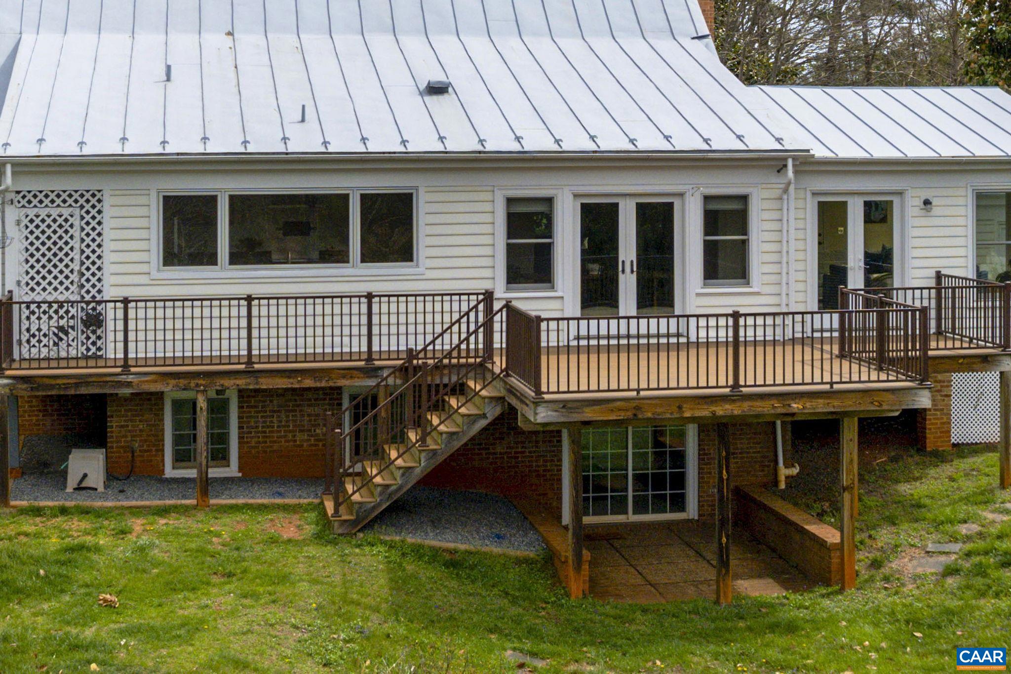 570 Rodes Drive Charlottesville, VA 22903 - Photo 50 of 75 a view of small house with yard and sitting area