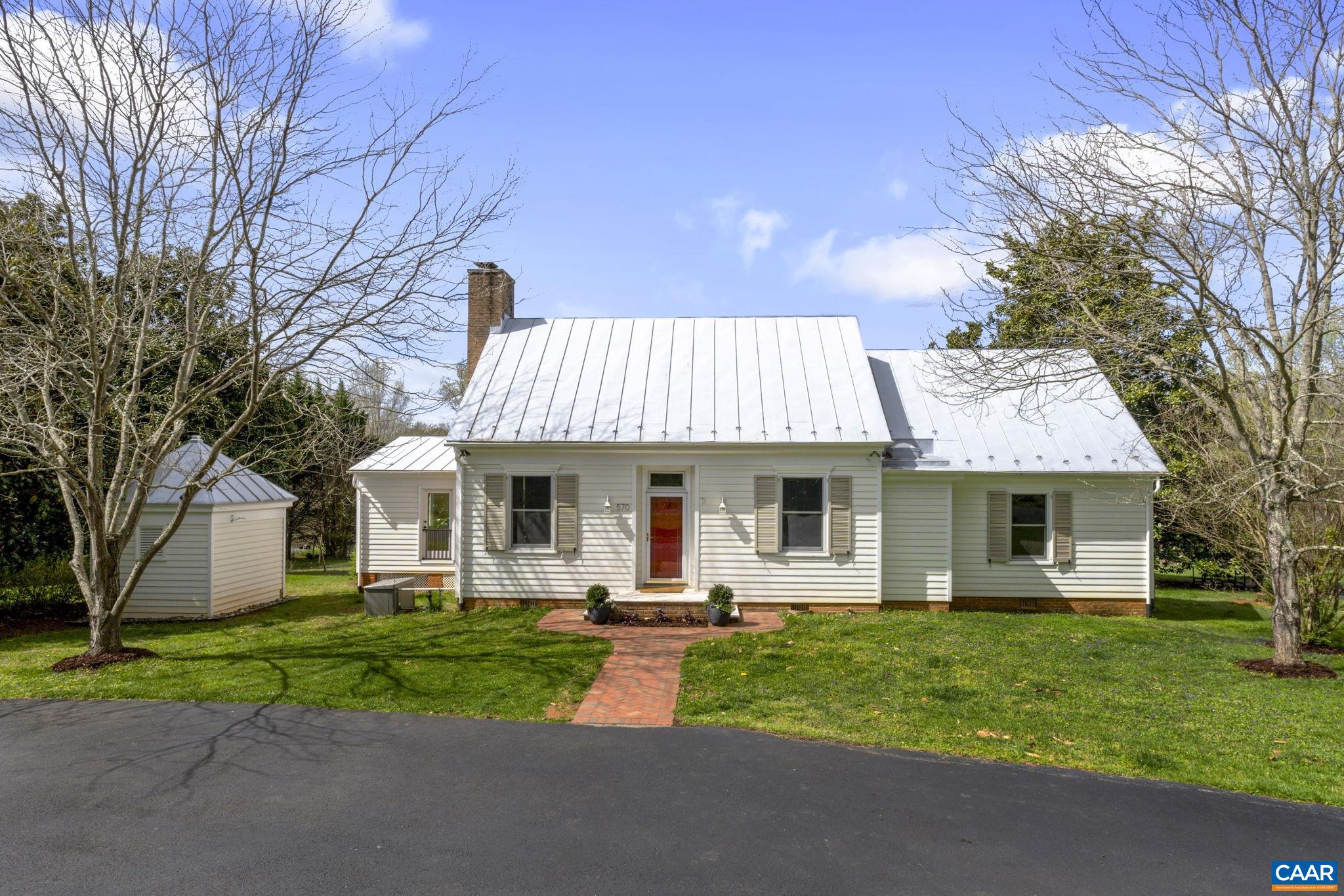 570 Rodes Drive Charlottesville, VA 22903 - Photo 5 of 75 a front view of house with yard and green space