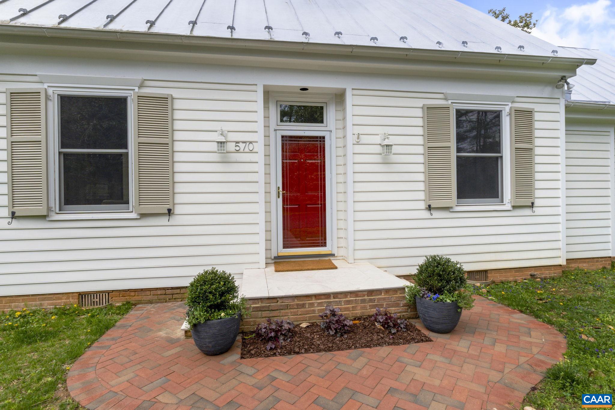 570 Rodes Drive Charlottesville, VA 22903 - Photo 7 of 75 a front view of a house with a yard