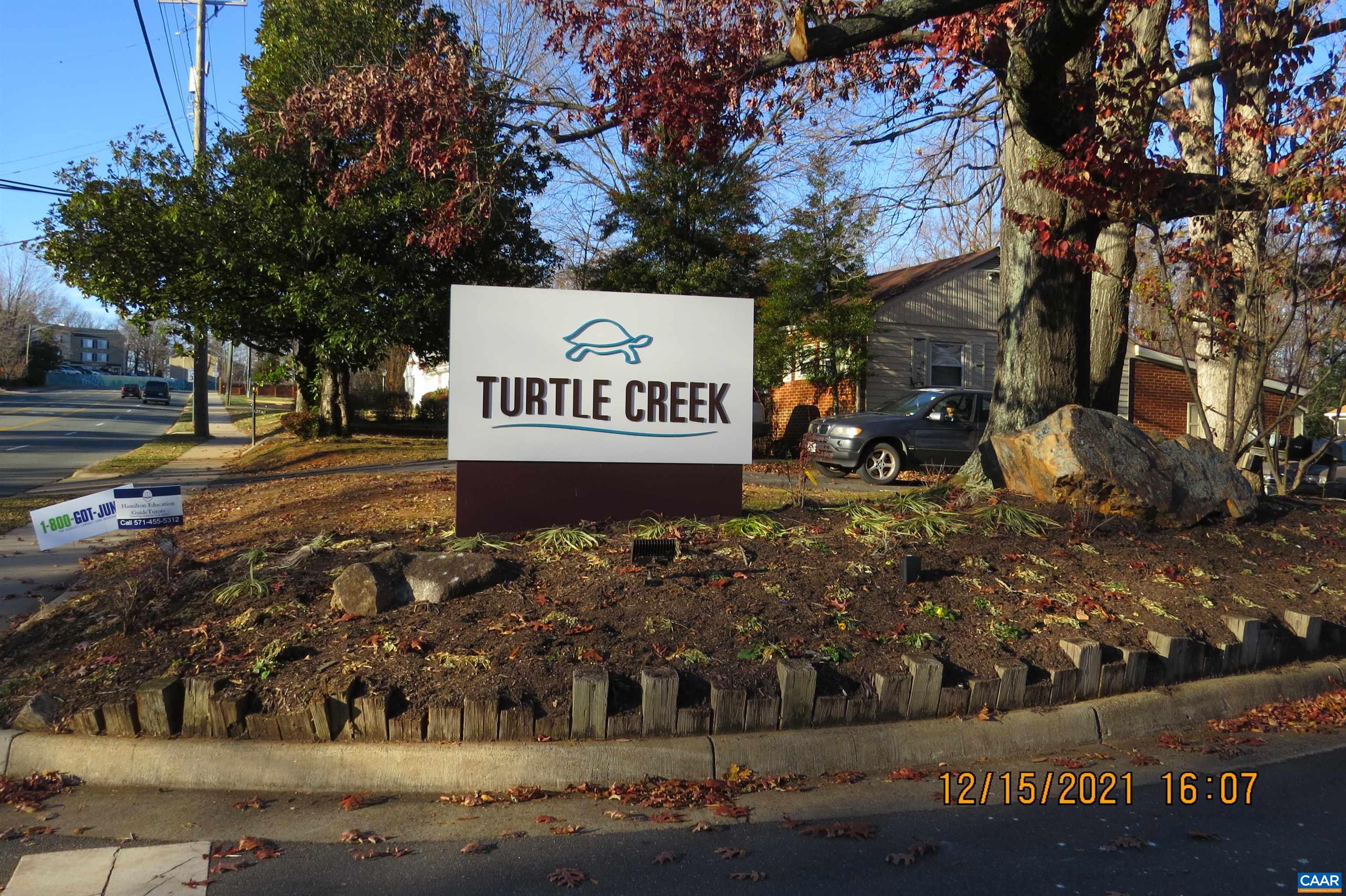 115 Turtle Creek Road, Unit 7 Charlottesville, VA 22901 - Photo 1 of 15 a sign on the side of the road