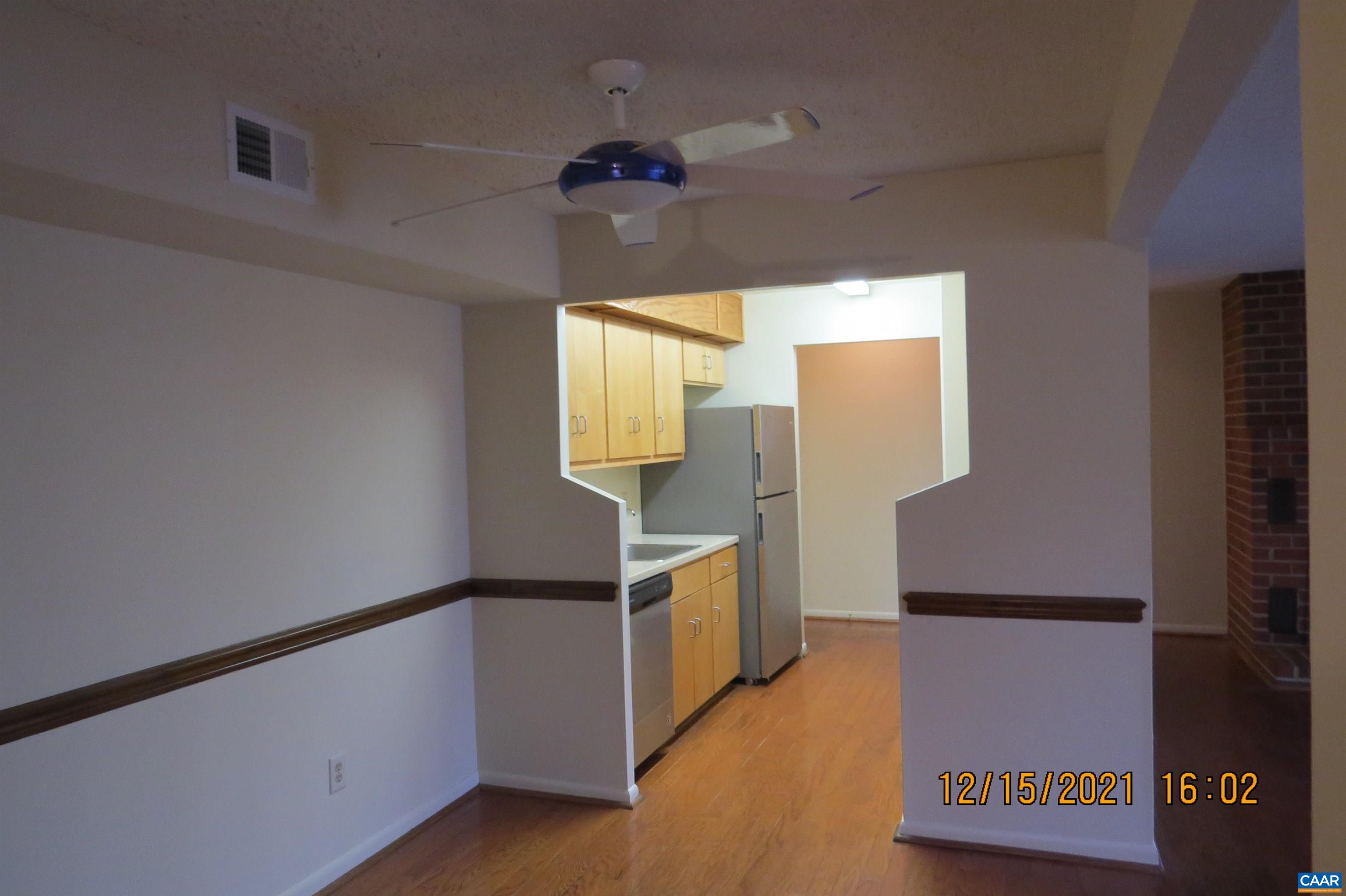 115 Turtle Creek Road, Unit 7 Charlottesville, VA 22901 - Photo 4 of 15 a kitchen with a refrigerator and a stove
