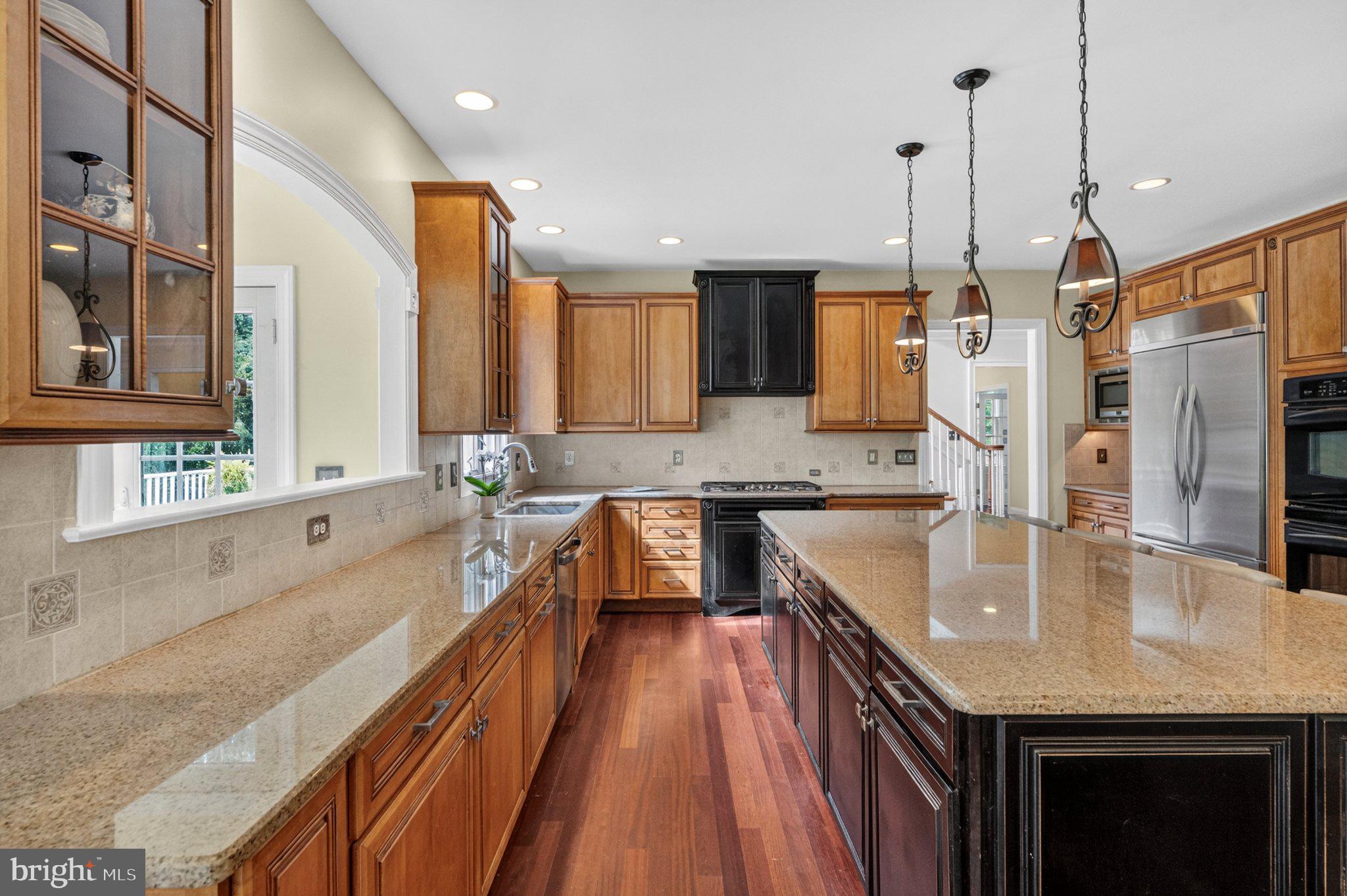 342 Ring Road Chadds Ford, PA 19317 - Photo 24 of 95 Elegant kitchen with rich wood tones.