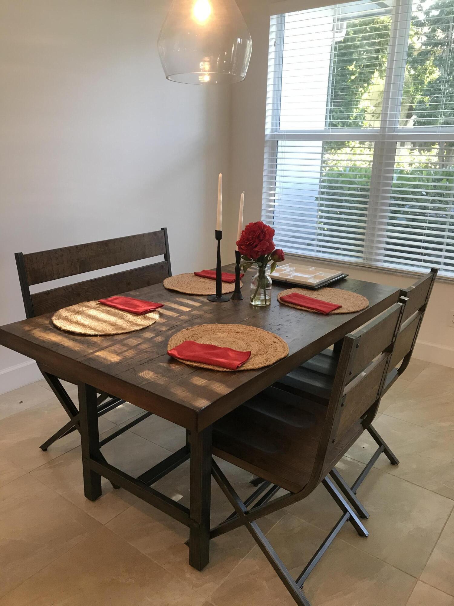 23045 Clear Echo Drive, Unit 76 Boca Raton, FL 33433 - Photo 13 of 35 a table and chairs in a room