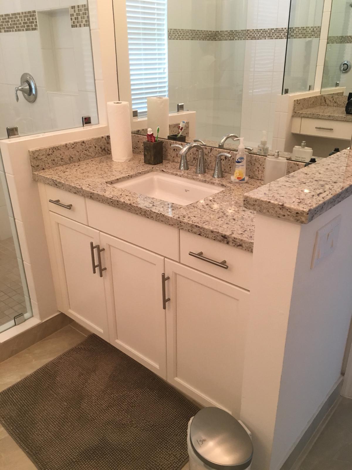 23045 Clear Echo Drive, Unit 76 Boca Raton, FL 33433 - Photo 25 of 35 a bathroom with a granite countertop sink and a mirror