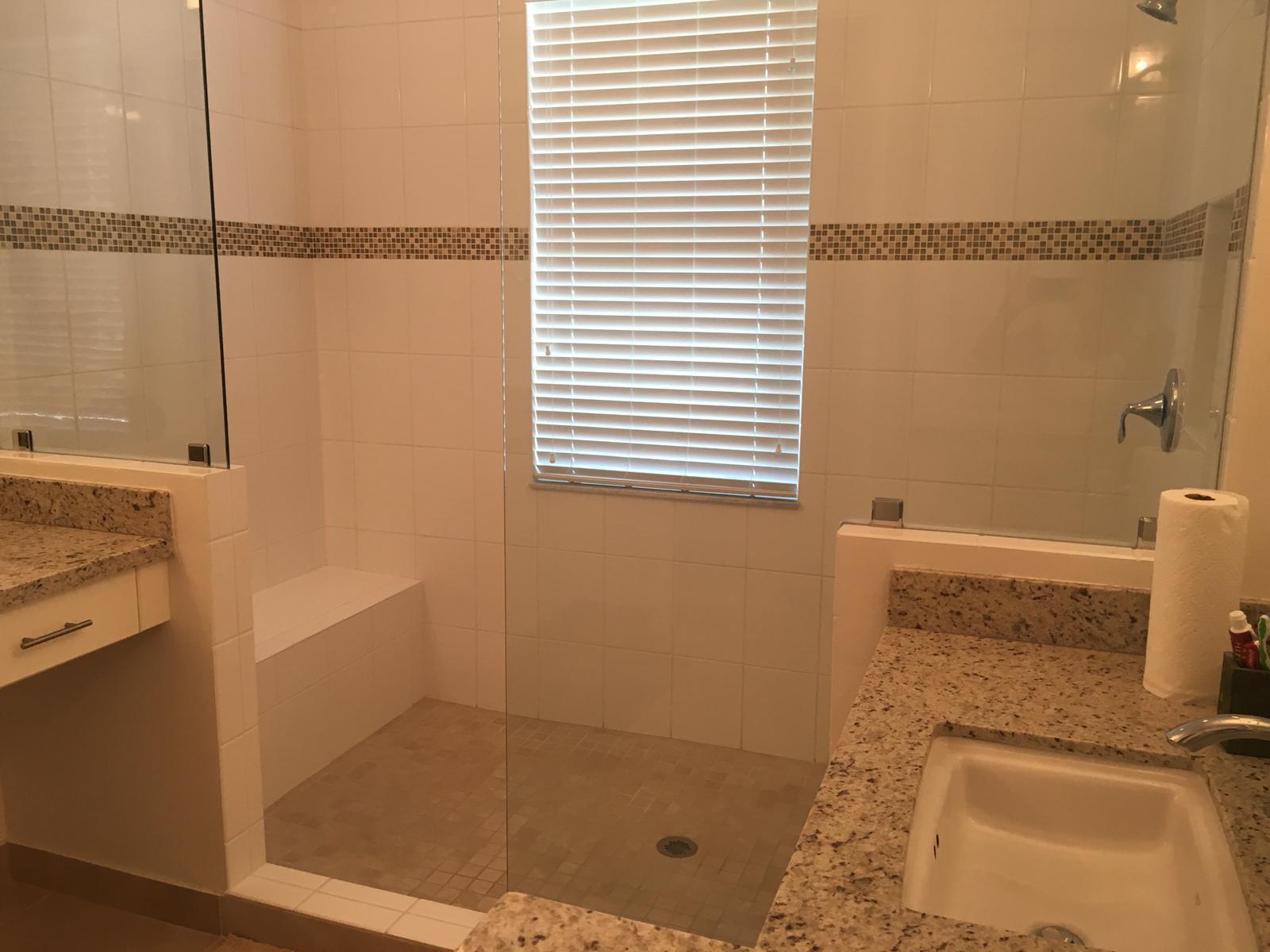 23045 Clear Echo Drive, Unit 76 Boca Raton, FL 33433 - Photo 26 of 35 a bathroom with a shower