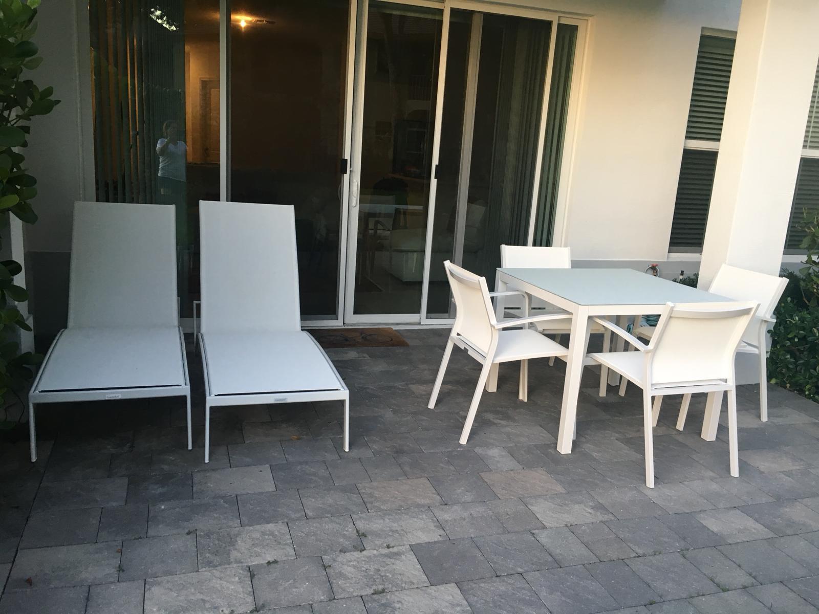23045 Clear Echo Drive, Unit 76 Boca Raton, FL 33433 - Photo 35 of 35 a view of a patio with table and chairs