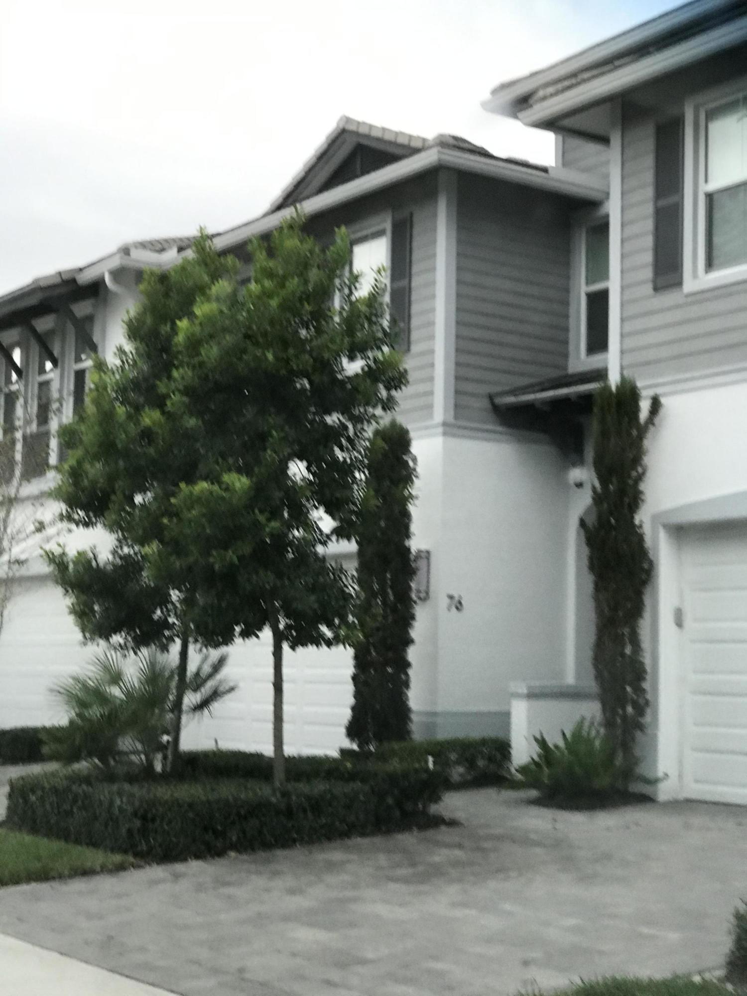 23045 Clear Echo Drive, Unit 76 Boca Raton, FL 33433 - Photo 4 of 35 a house that has a tree in front of it