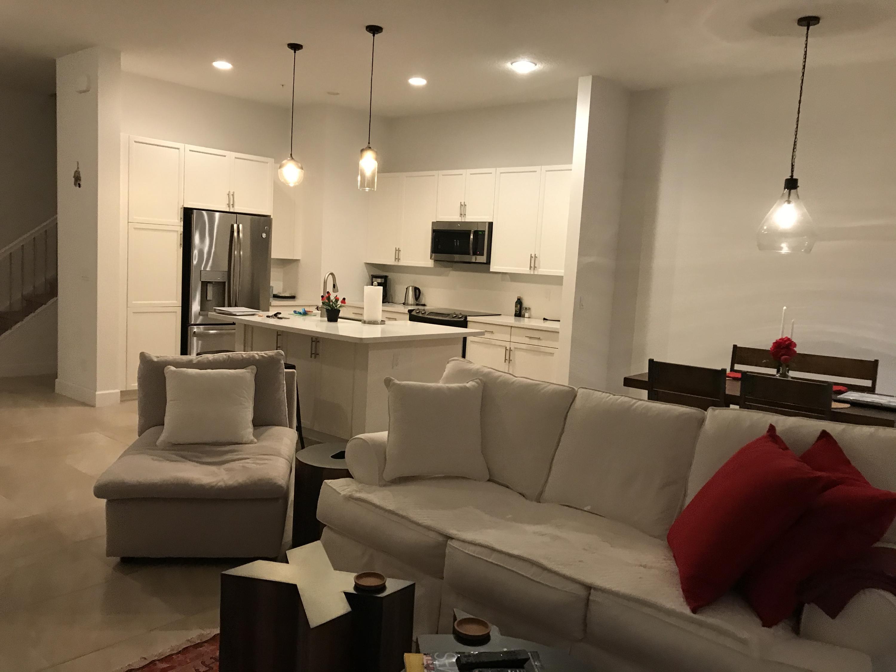 23045 Clear Echo Drive, Unit 76 Boca Raton, FL 33433 - Photo 10 of 35 a living room with furniture and a flat screen tv