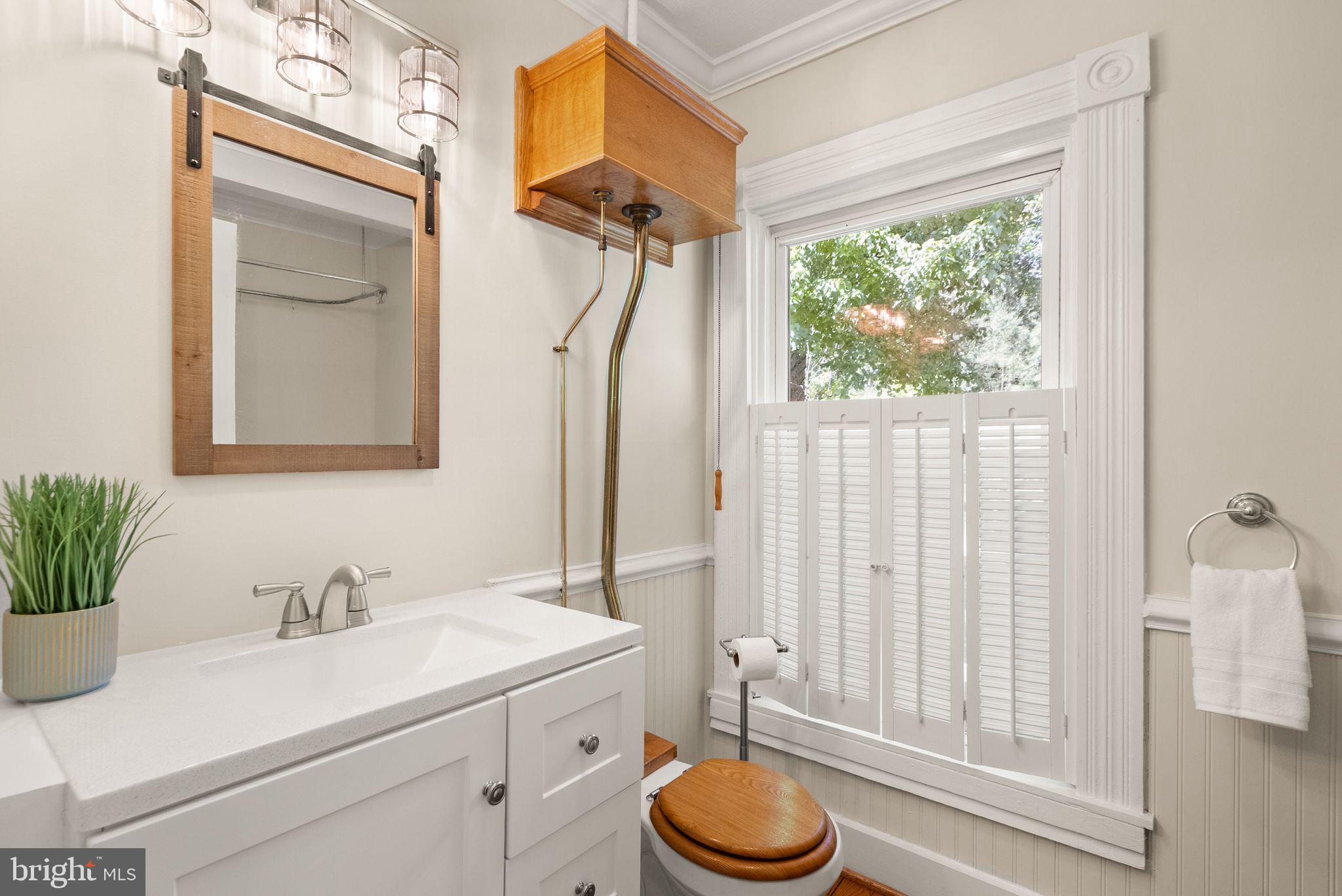 37151 Branchriver Road Purcellville, VA 20132 - Photo 42 of 63 a bathroom with a sink a toilet and a mirror