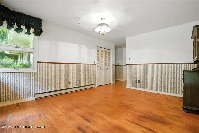 a kitchen with stainless steel appliances granite countertop a sink and a microwave
