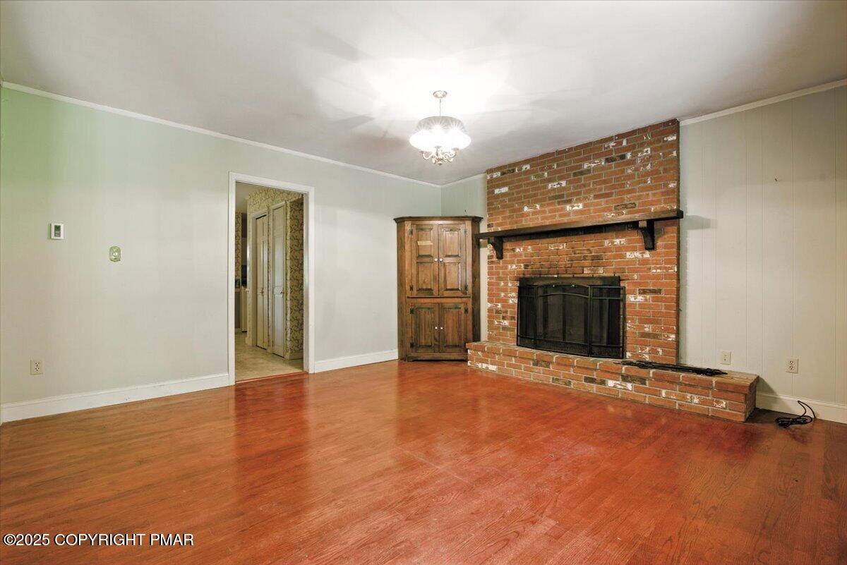 142 Pine Grove Road Kunkletown, PA 18058 - Photo 17 of 78 an empty room with windows and fireplace