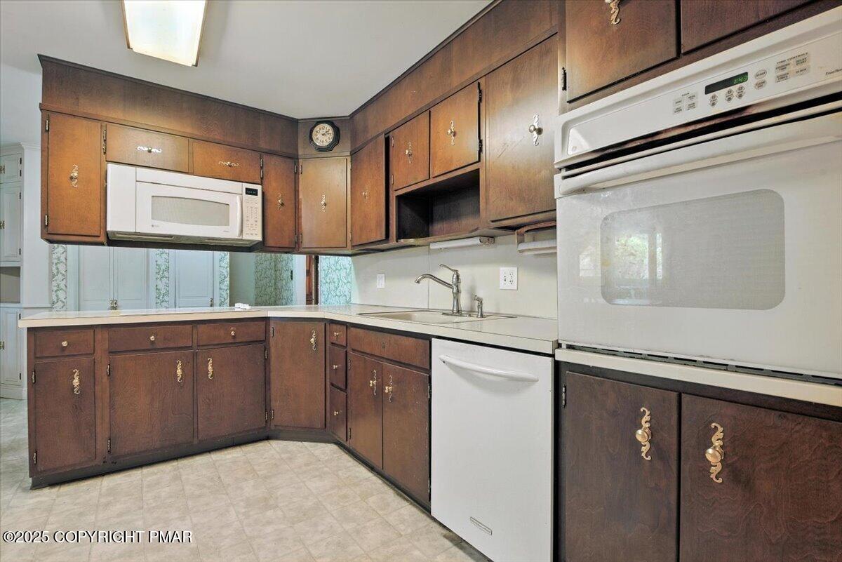 142 Pine Grove Road Kunkletown, PA 18058 - Photo 20 of 78 a kitchen with stainless steel appliances granite countertop a sink and a microwave