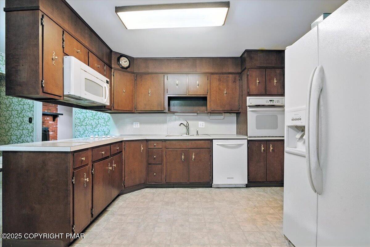 142 Pine Grove Road Kunkletown, PA 18058 - Photo 22 of 78 a kitchen with stainless steel appliances granite countertop a refrigerator sink and cabinets