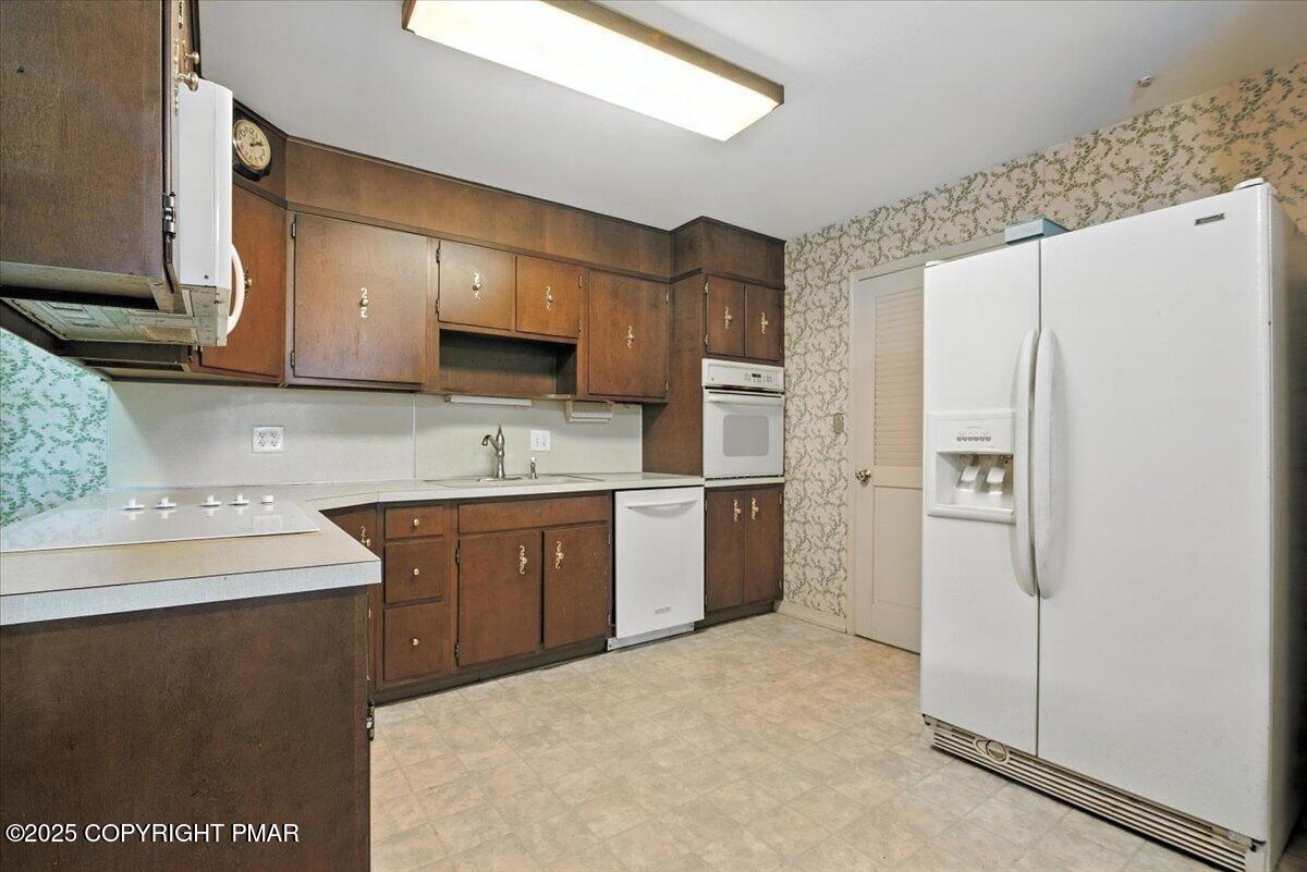 142 Pine Grove Road Kunkletown, PA 18058 - Photo 23 of 78 a kitchen with stainless steel appliances granite countertop a refrigerator sink and stove