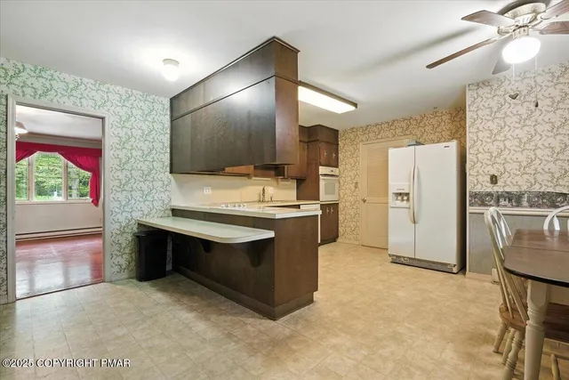a bathroom with a sink vanity and a toilet