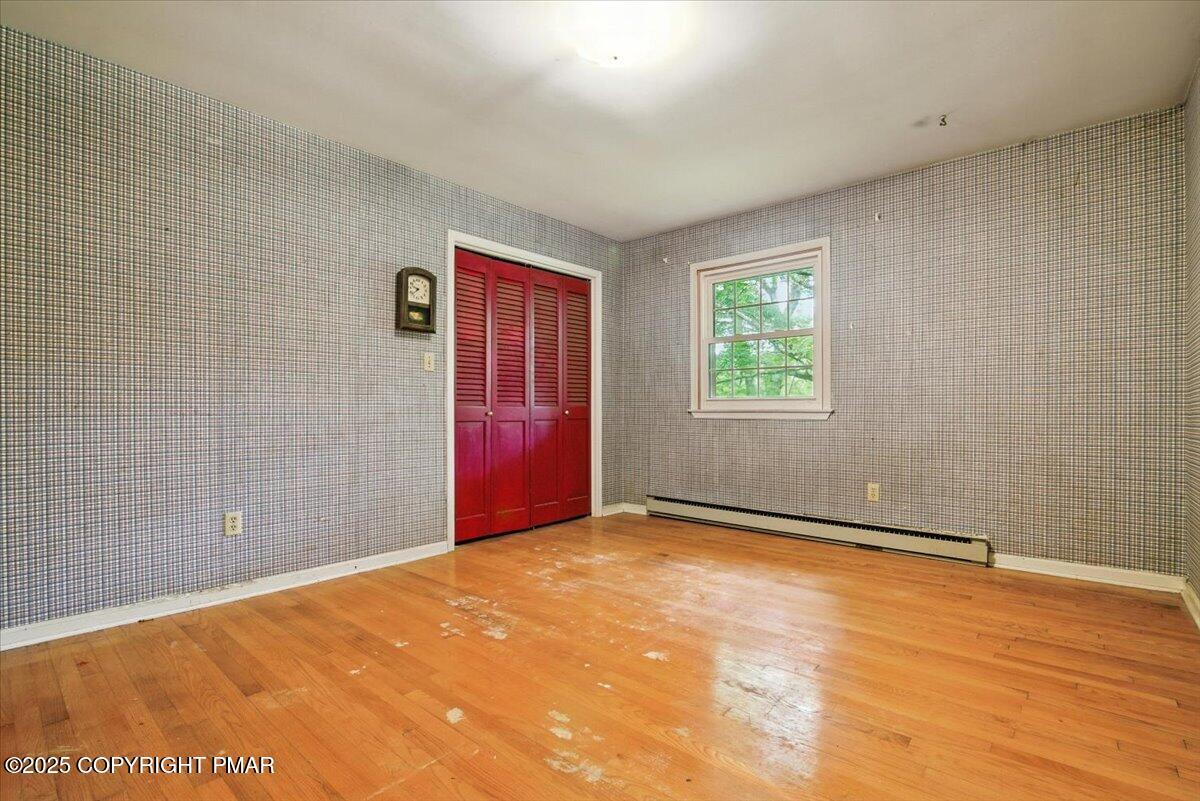 142 Pine Grove Road Kunkletown, PA 18058 - Photo 30 of 78 a view of an empty room with wooden floor and a window